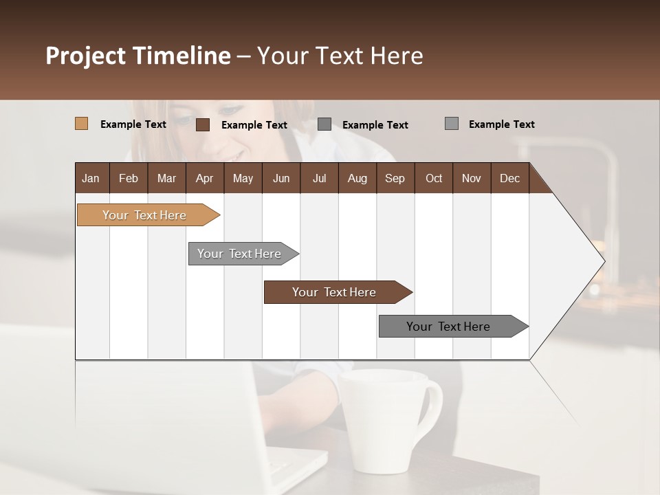 A Woman Sitting At A Table Using A Laptop Computer PowerPoint Template