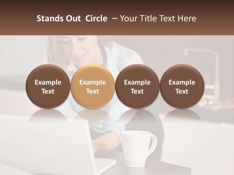 A Woman Sitting At A Table Using A Laptop Computer PowerPoint Template