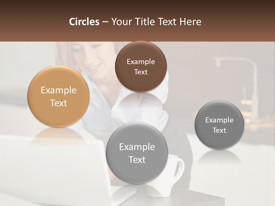 A Woman Sitting At A Table Using A Laptop Computer PowerPoint Template