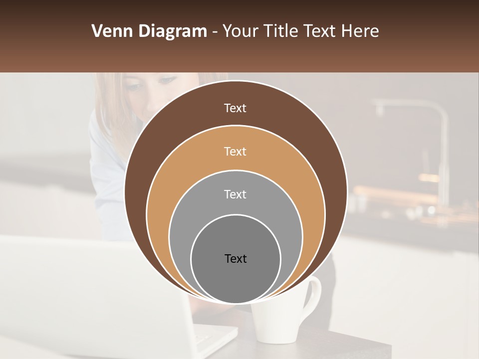 A Woman Sitting At A Table Using A Laptop Computer PowerPoint Template