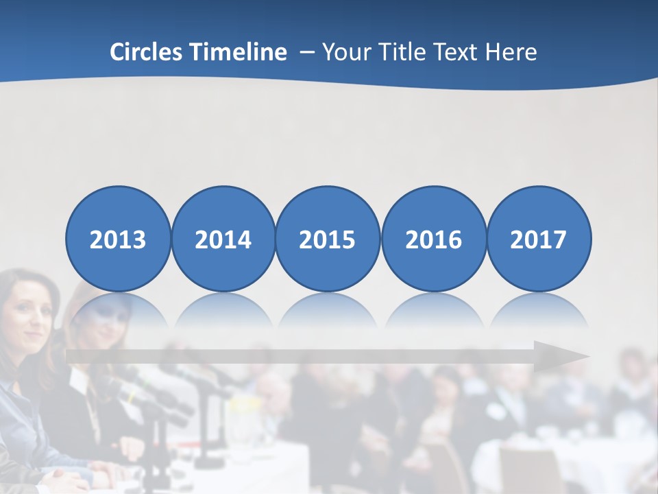 A Group Of People Sitting At A Table In Front Of Microphones PowerPoint Template