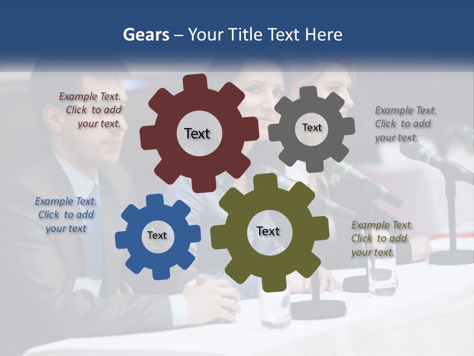 A Group Of People Sitting At A Table With Microphones PowerPoint Template