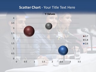 A Group Of People Sitting At A Table With Microphones PowerPoint Template