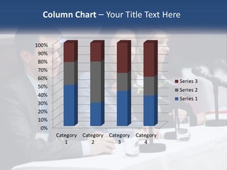 A Group Of People Sitting At A Table With Microphones PowerPoint Template