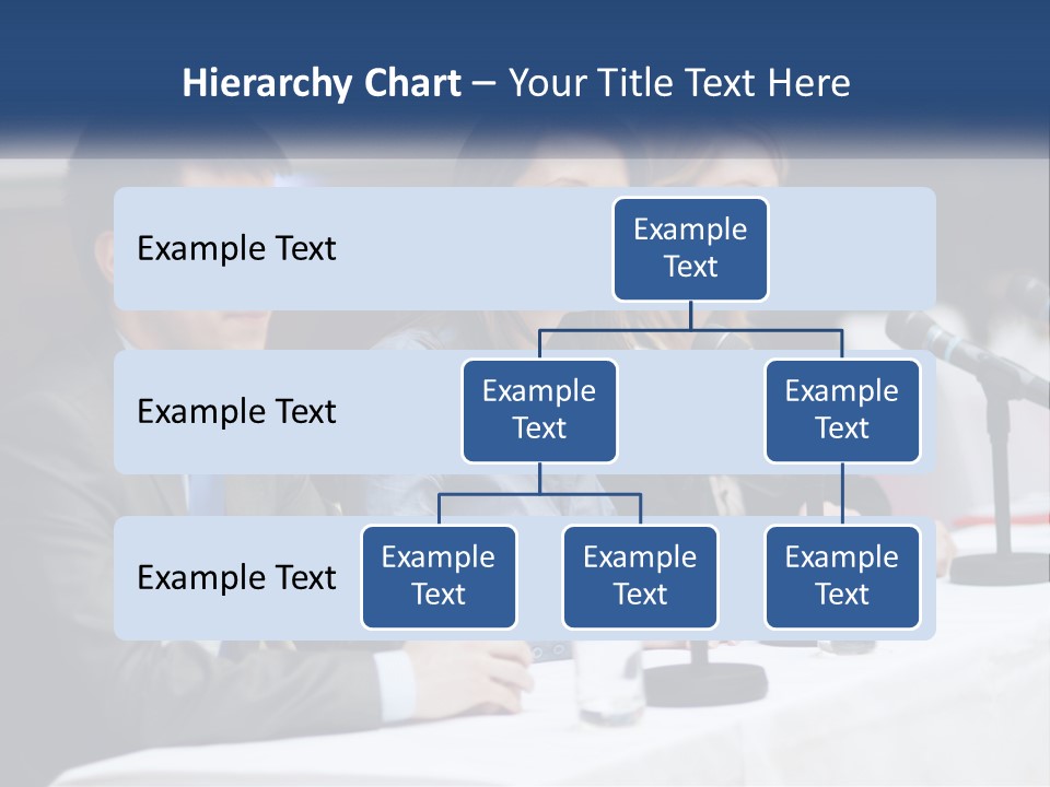 A Group Of People Sitting At A Table With Microphones PowerPoint Template