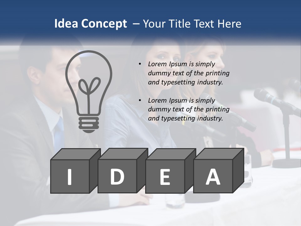 A Group Of People Sitting At A Table With Microphones PowerPoint Template