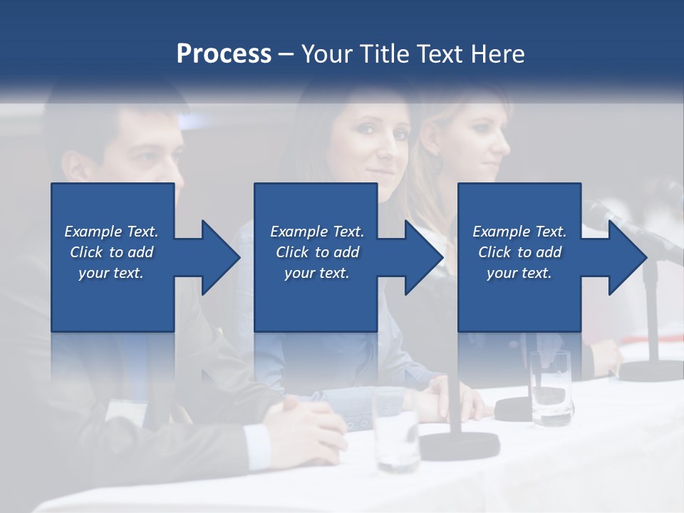 A Group Of People Sitting At A Table With Microphones PowerPoint Template