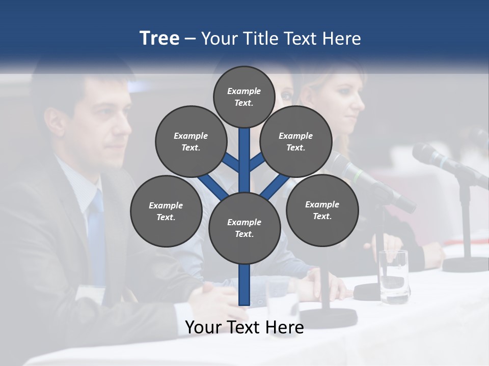 A Group Of People Sitting At A Table With Microphones PowerPoint Template