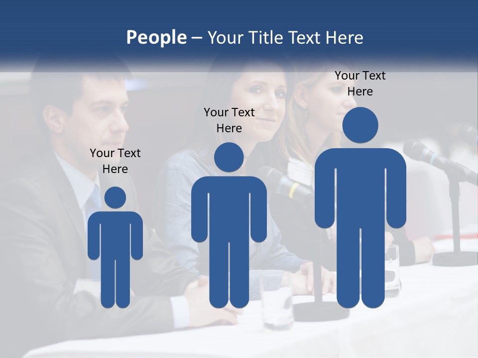 A Group Of People Sitting At A Table With Microphones PowerPoint Template