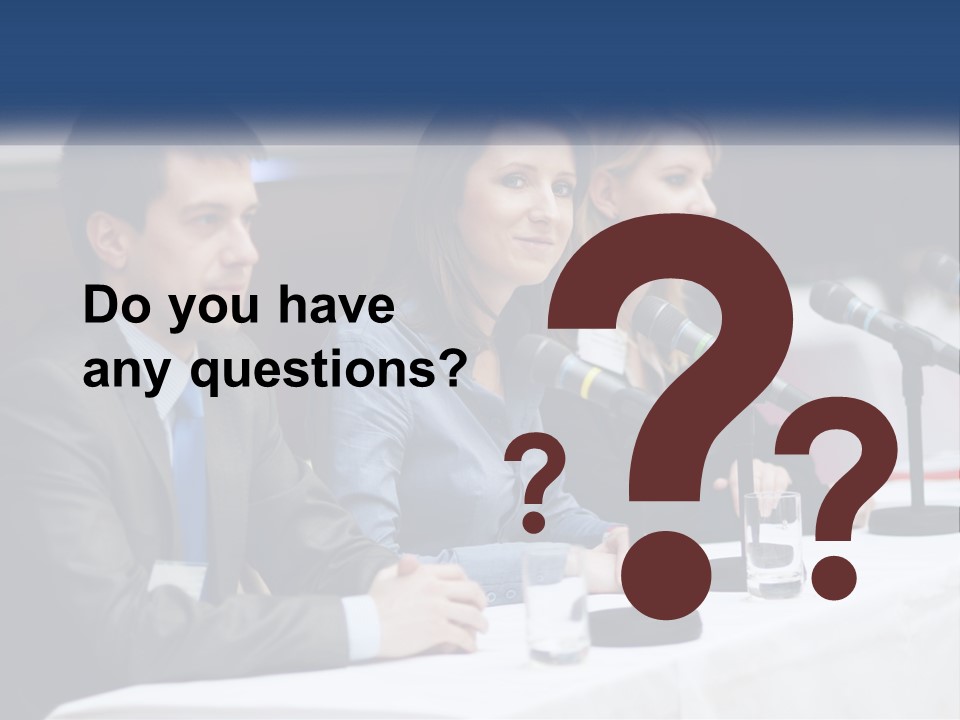 A Group Of People Sitting At A Table With Microphones PowerPoint Template