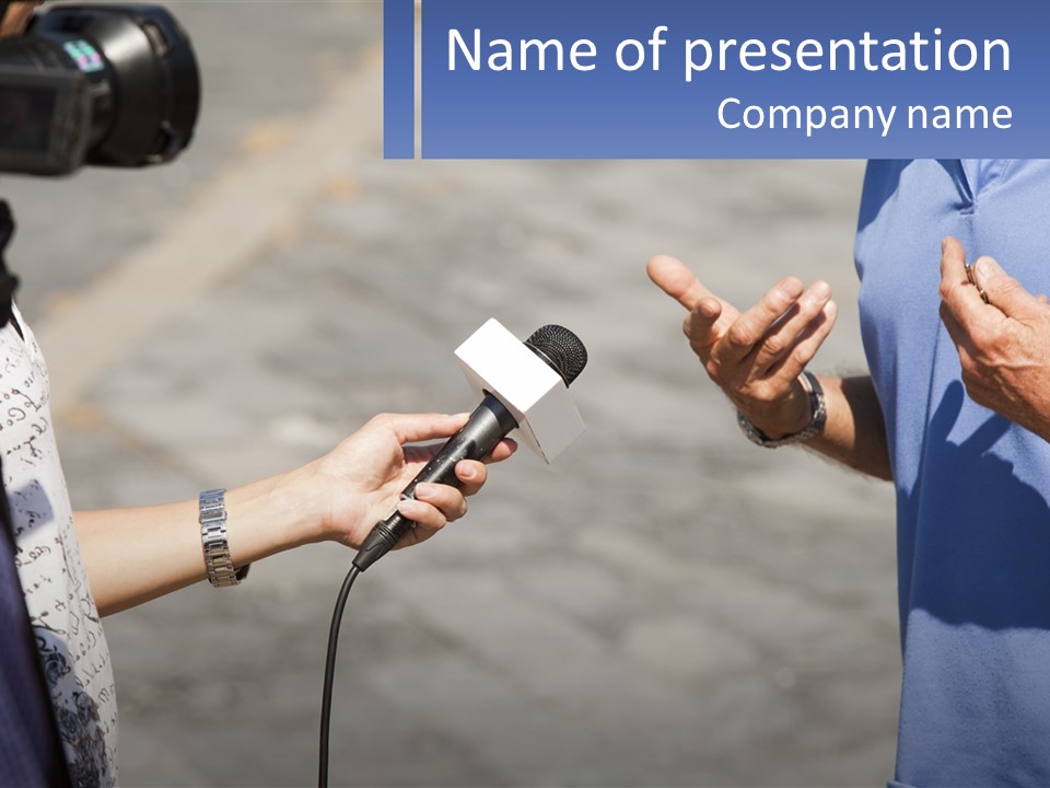 A Person Holding A Microphone With A Microphone In Front Of Them PowerPoint Template