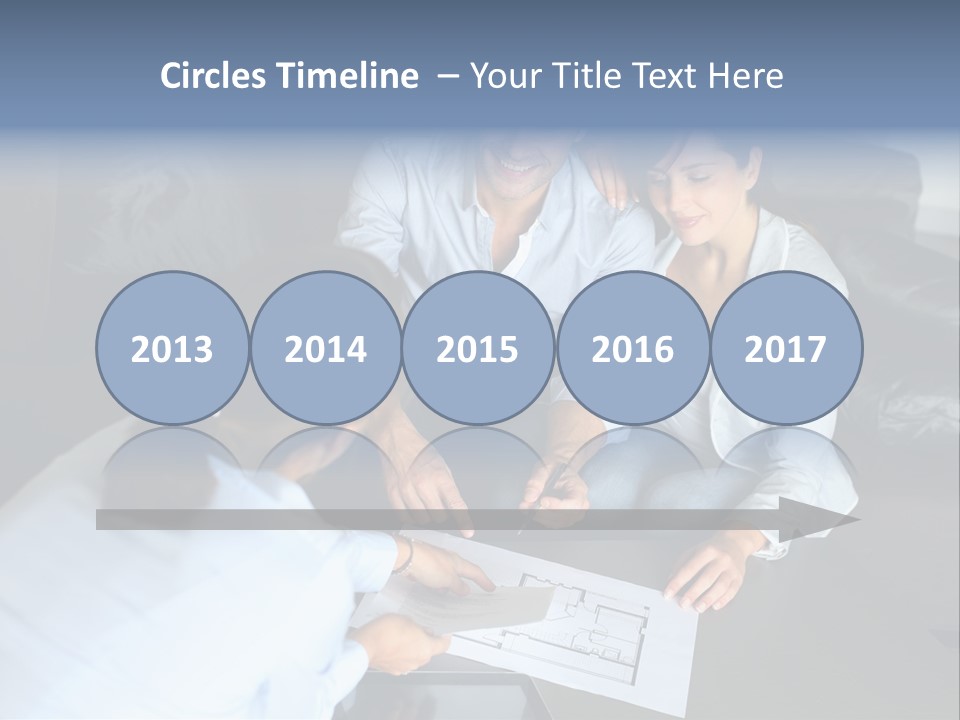 A Man And Woman Sitting On A Couch Looking At A Blueprint PowerPoint Template