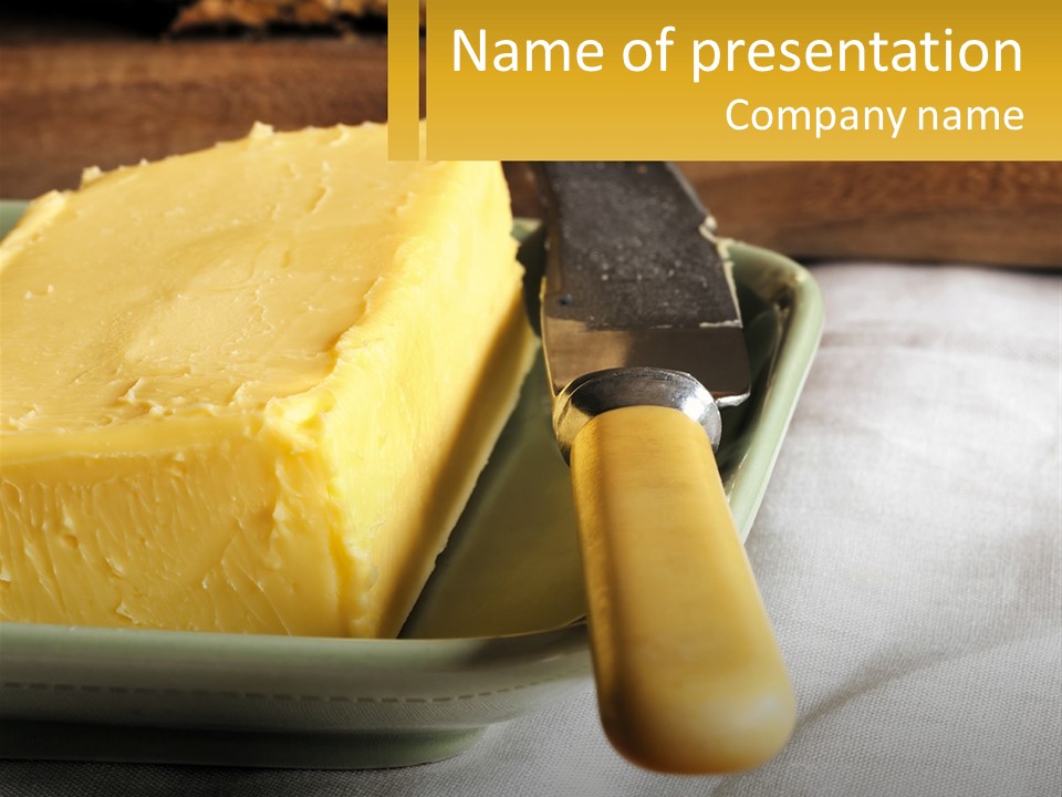 A Piece Of Cheese On A Plate With A Knife PowerPoint Template