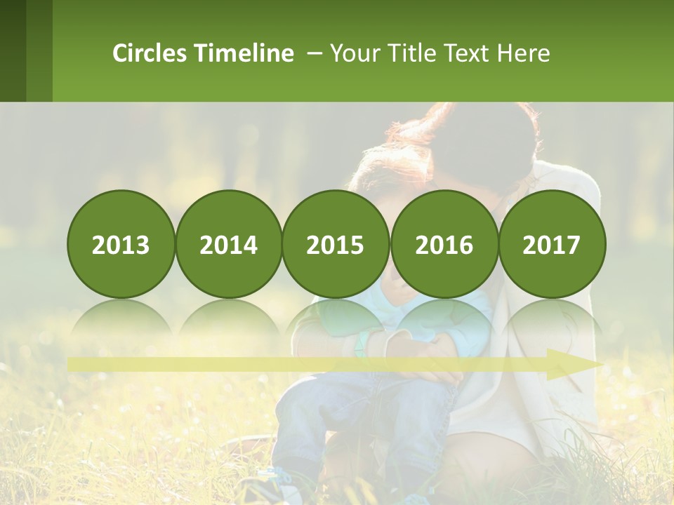 A Woman Holding A Baby In A Field Of Grass PowerPoint Template