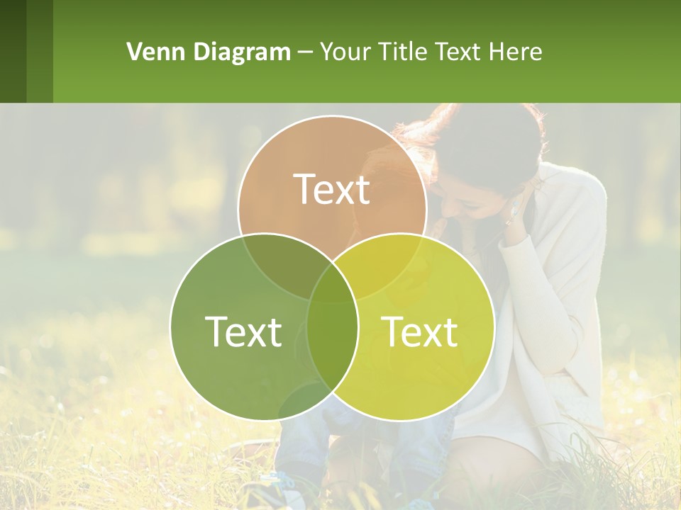 A Woman Holding A Baby In A Field Of Grass PowerPoint Template