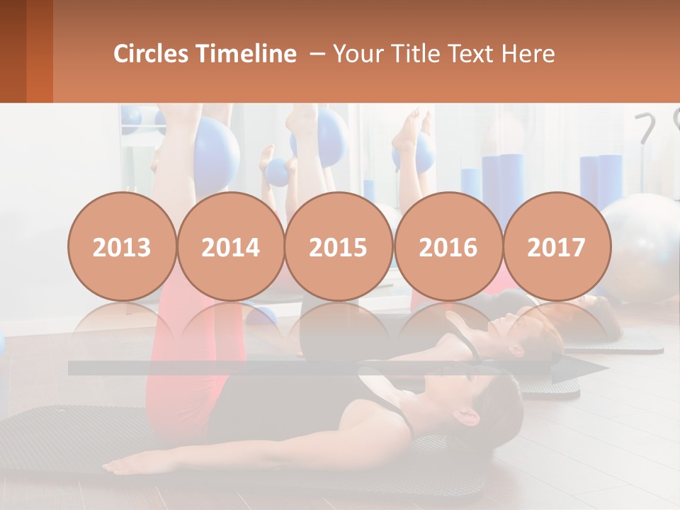 A Group Of Women Doing Yoga Exercises In A Gym PowerPoint Template