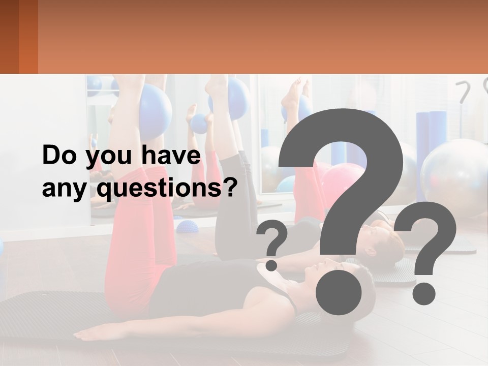 A Group Of Women Doing Yoga Exercises In A Gym PowerPoint Template