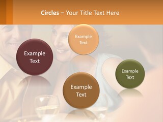 A Man And Woman Sitting At A Table With A Glass Of Wine PowerPoint Template