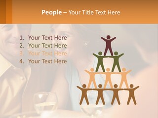 A Man And Woman Sitting At A Table With A Glass Of Wine PowerPoint Template