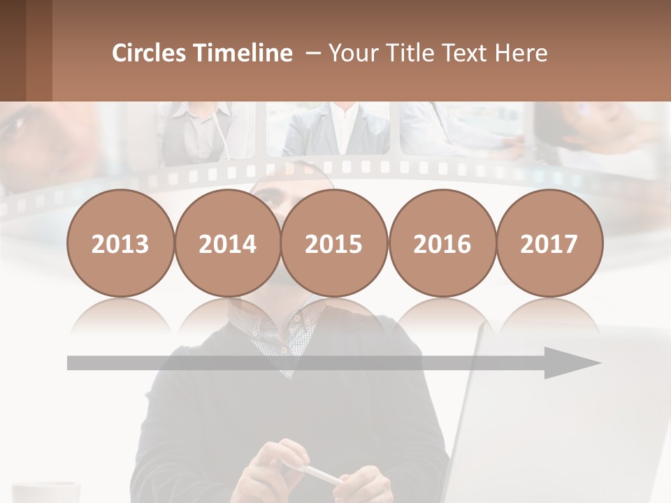 A Man Sitting In Front Of A Laptop Computer PowerPoint Template