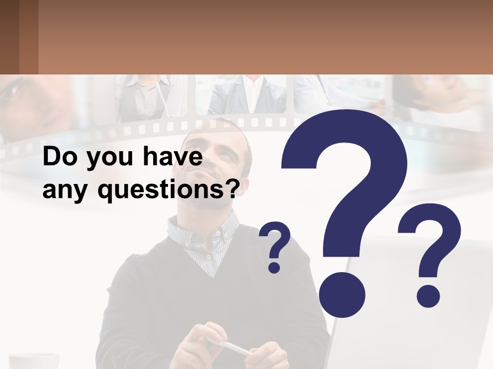 A Man Sitting In Front Of A Laptop Computer PowerPoint Template