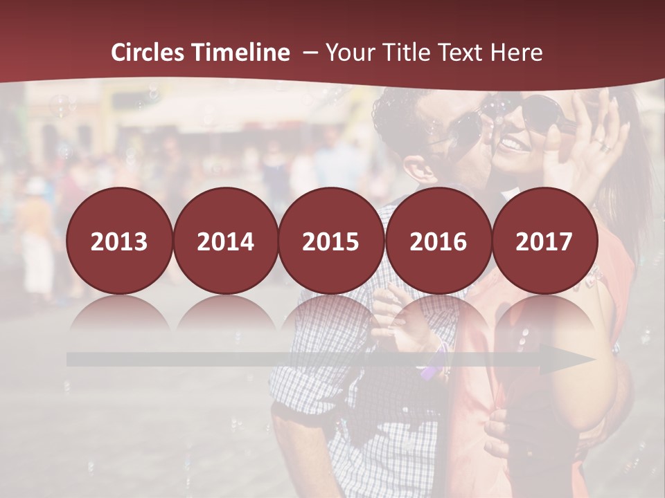 A Man And Woman Are Kissing In Front Of A Crowd Of People PowerPoint Template