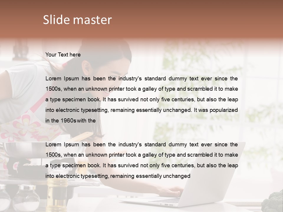 A Woman Using A Laptop On A Kitchen Counter PowerPoint Template