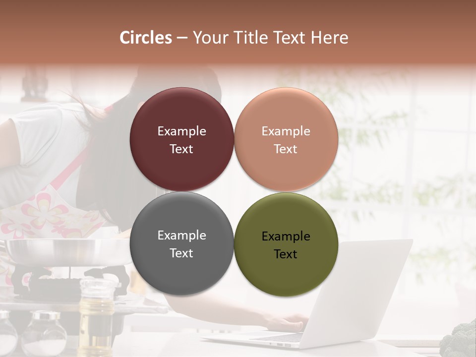 A Woman Using A Laptop On A Kitchen Counter PowerPoint Template