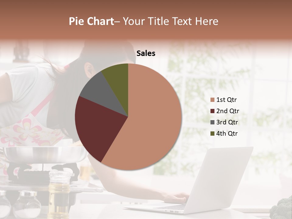A Woman Using A Laptop On A Kitchen Counter PowerPoint Template
