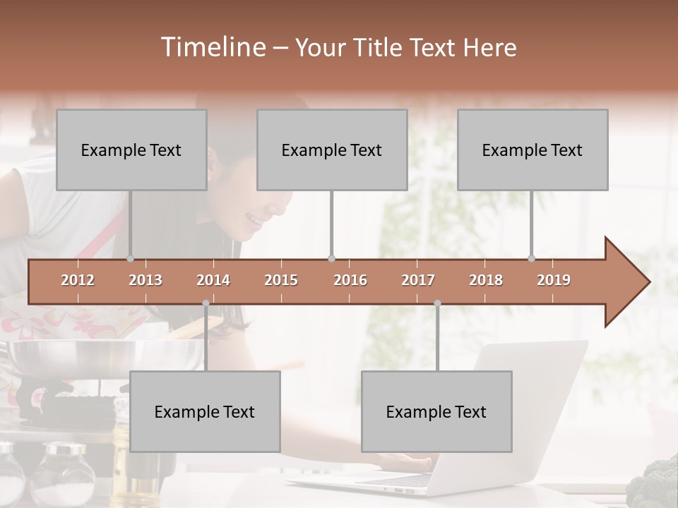 A Woman Using A Laptop On A Kitchen Counter PowerPoint Template