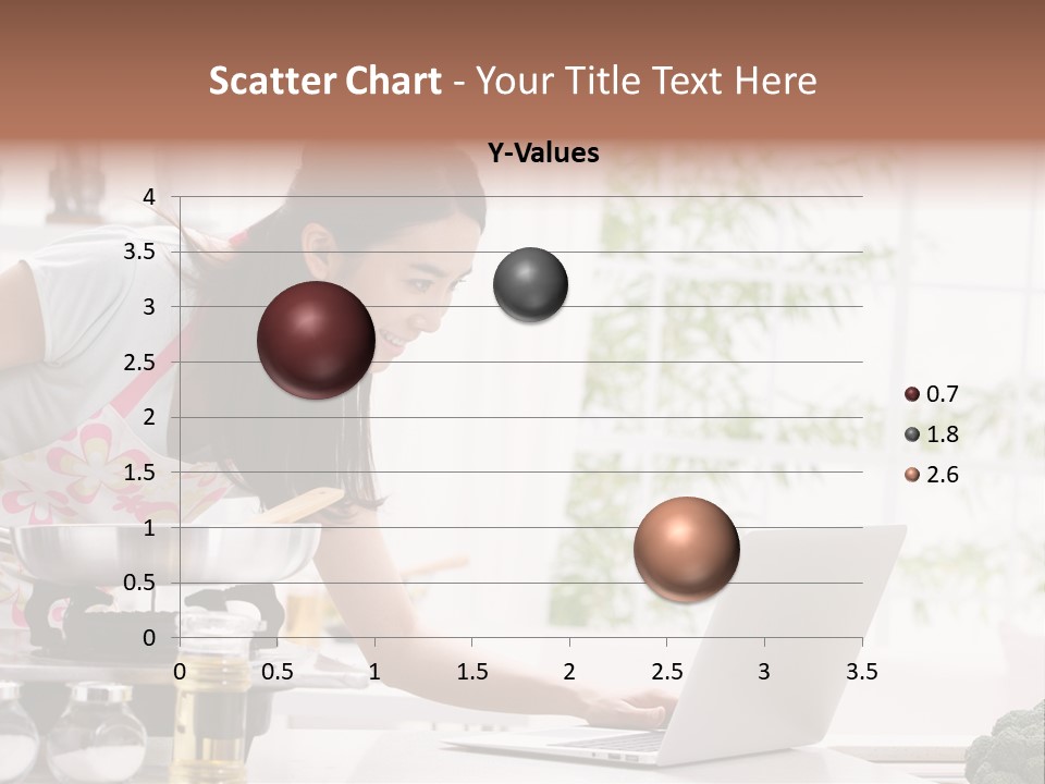 A Woman Using A Laptop On A Kitchen Counter PowerPoint Template