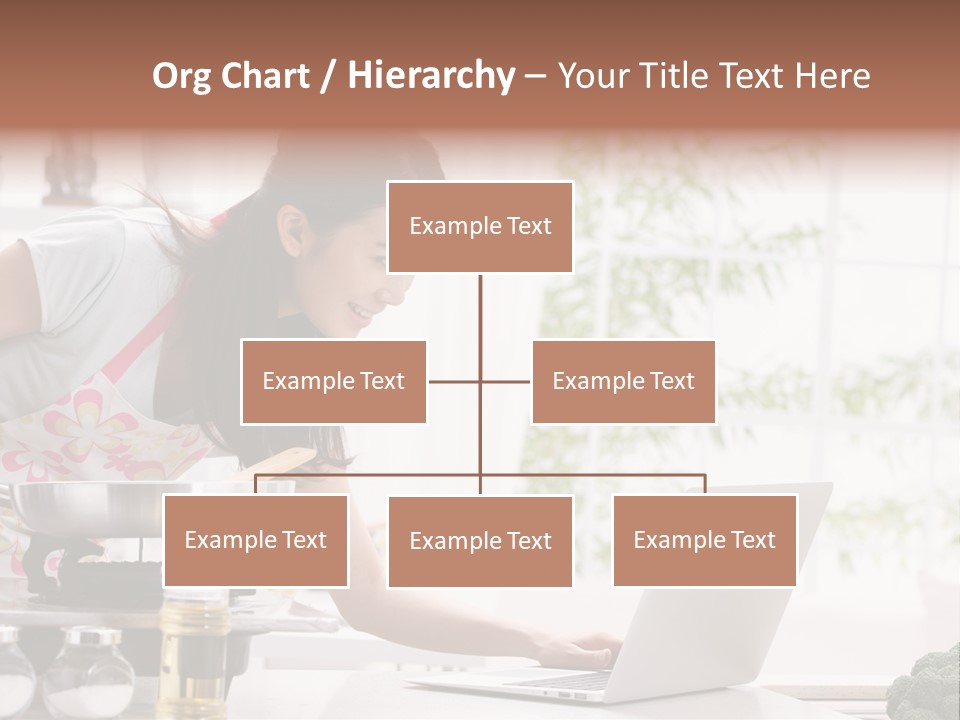 A Woman Using A Laptop On A Kitchen Counter PowerPoint Template