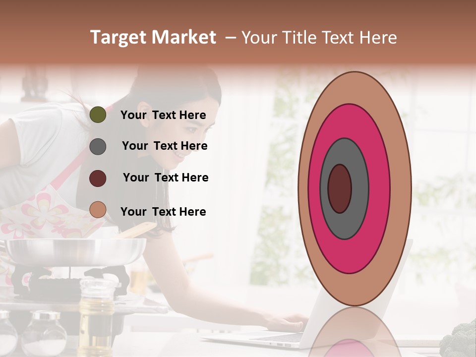 A Woman Using A Laptop On A Kitchen Counter PowerPoint Template