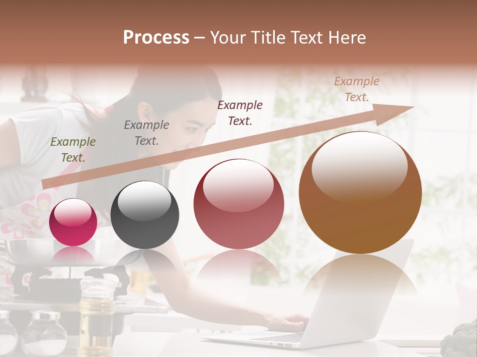 A Woman Using A Laptop On A Kitchen Counter PowerPoint Template