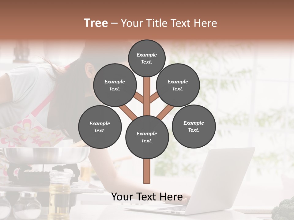 A Woman Using A Laptop On A Kitchen Counter PowerPoint Template