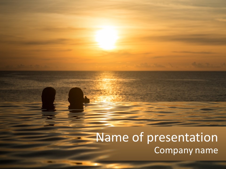 Two People In The Water At Sunset Powerpoint Template PowerPoint Template