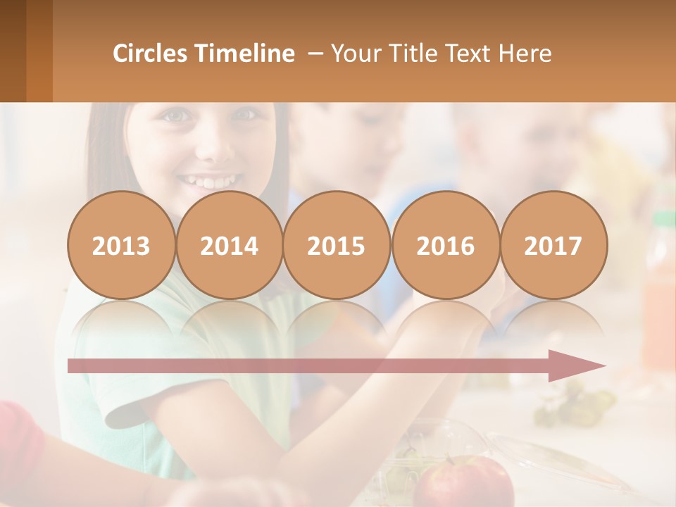 A Group Of Children Sitting At A Table Eating Food PowerPoint Template