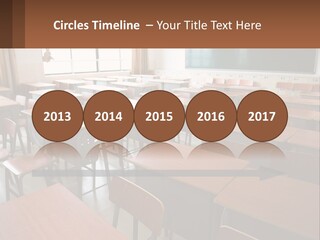 A Classroom With Desks And A Chalk Board PowerPoint Template