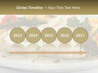 A White Plate Topped With Fish And Vegetables PowerPoint Template