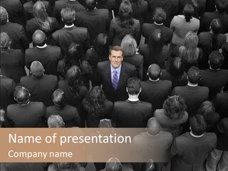 A Man In A Suit Standing In Front Of A Crowd Of People PowerPoint Template