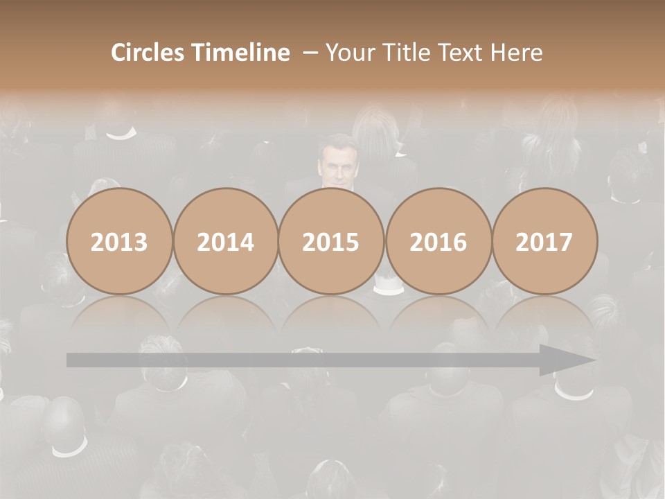 A Man In A Suit Standing In Front Of A Crowd Of People PowerPoint Template