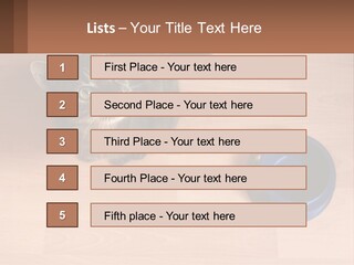 A Cat Sitting Next To A Blue Bowl On A Wooden Floor PowerPoint Template