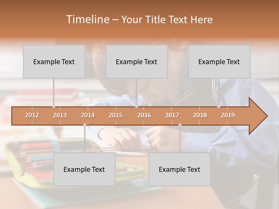A Young Boy Writing On A Piece Of Paper PowerPoint Template