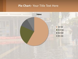 A Man Walking Down A Flooded Street Past A Building PowerPoint Template