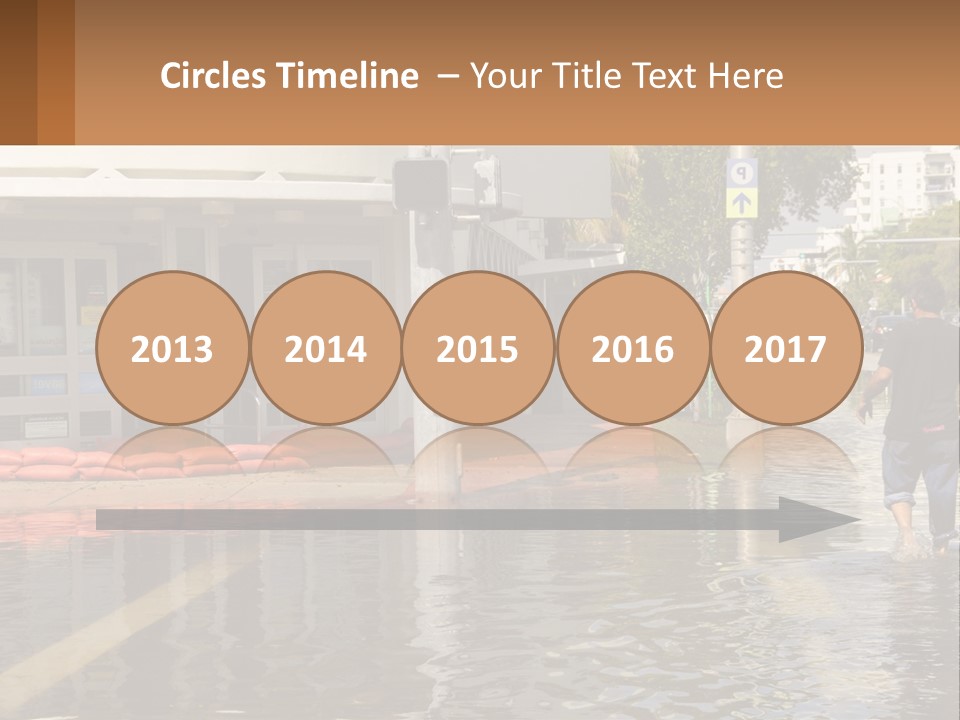 A Man Walking Down A Flooded Street Past A Building PowerPoint Template