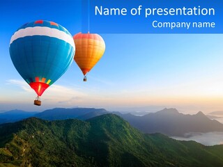 Two Hot Air Balloons Flying Over A Mountain Range PowerPoint Template