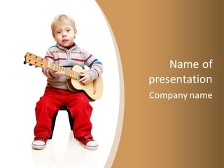 A Little Boy Sitting On The Ground Playing A Guitar PowerPoint Template
