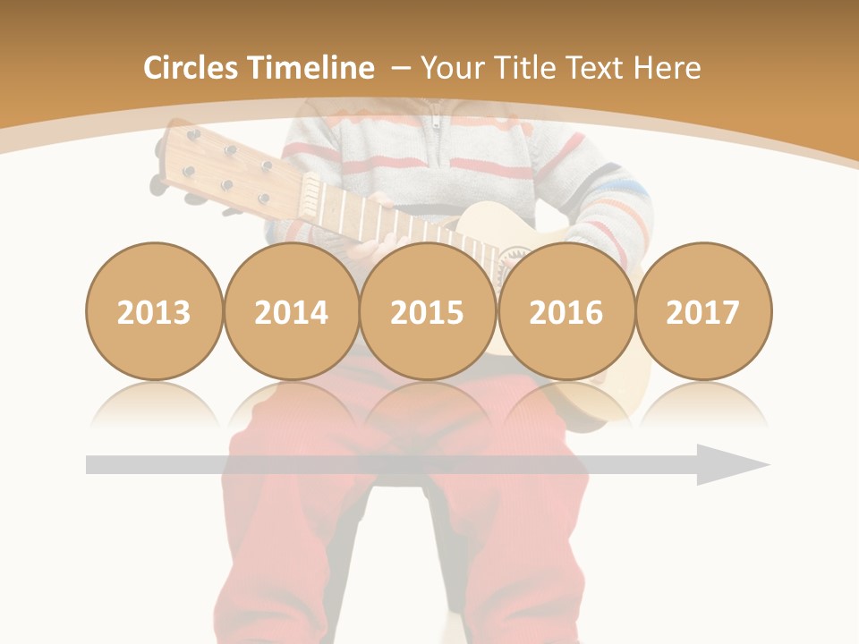 A Little Boy Sitting On The Ground Playing A Guitar PowerPoint Template