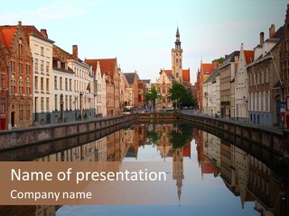 A River Running Through A City Next To Tall Buildings PowerPoint Template