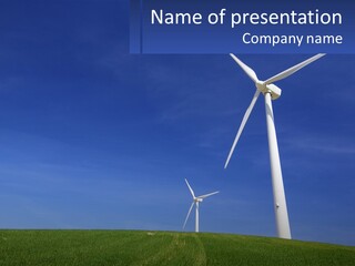 A Group Of Windmills In A Green Field PowerPoint Template